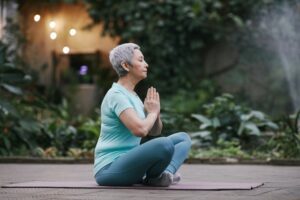older Adults: An elderly woman meditating